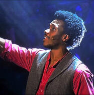 a close-up image of michael ahomka-lindsay performing santa fe as jack kelly at the Big Night of Musicals in 2024. taken by minnale_photography on instagram.